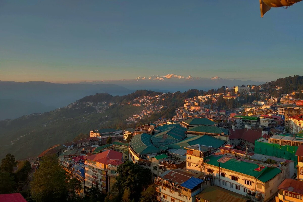Darjeeling tour cost aerial view of the town and Himalayan mountains