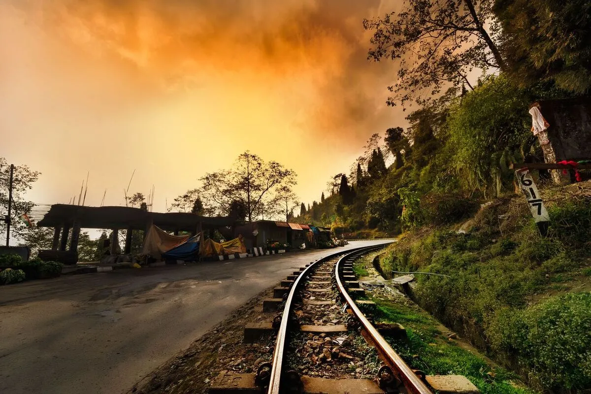Darjeeling weather with railway curves and sunset landscape